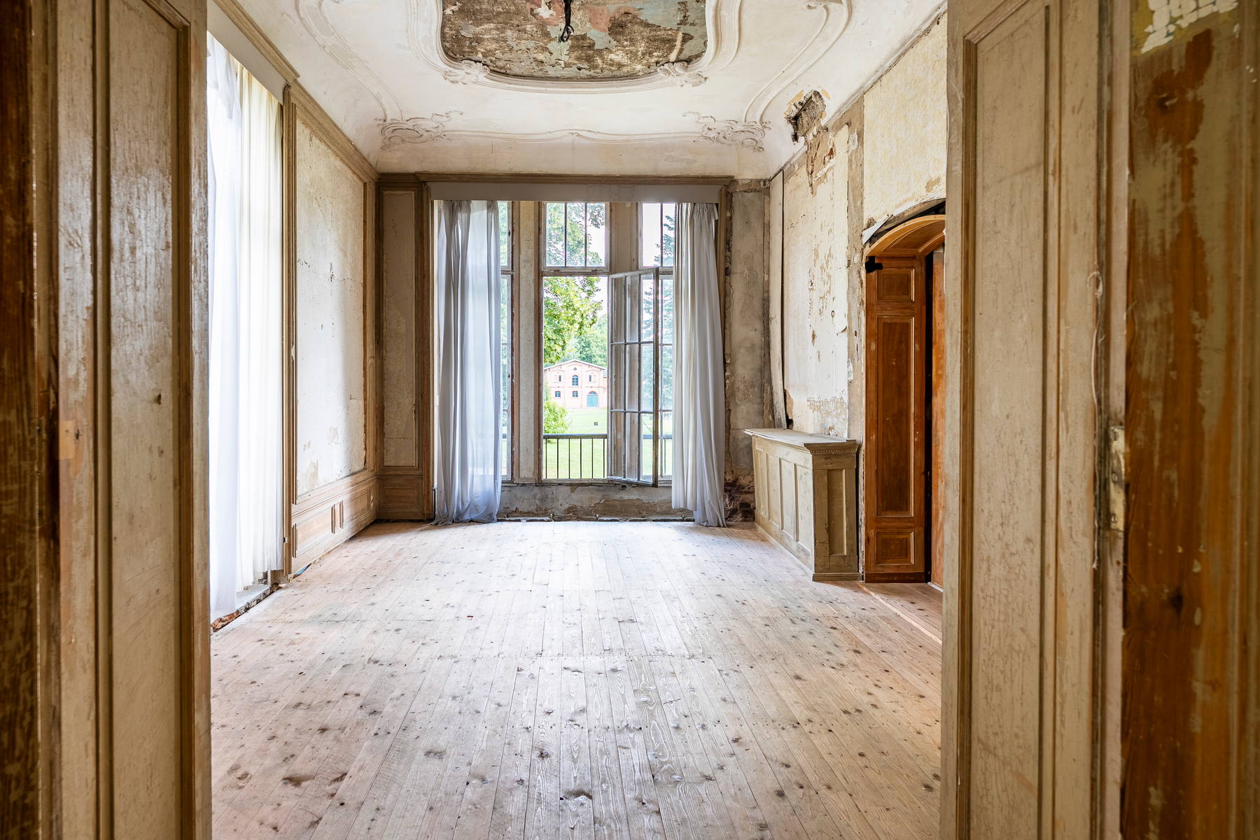 A room with the stucco cartouche of the painted ceiling